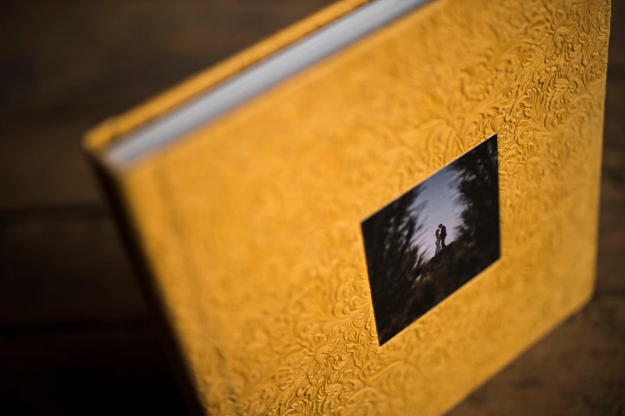 Gold-embossed Italian-leather heirloom album with a photo cameo set into the cover