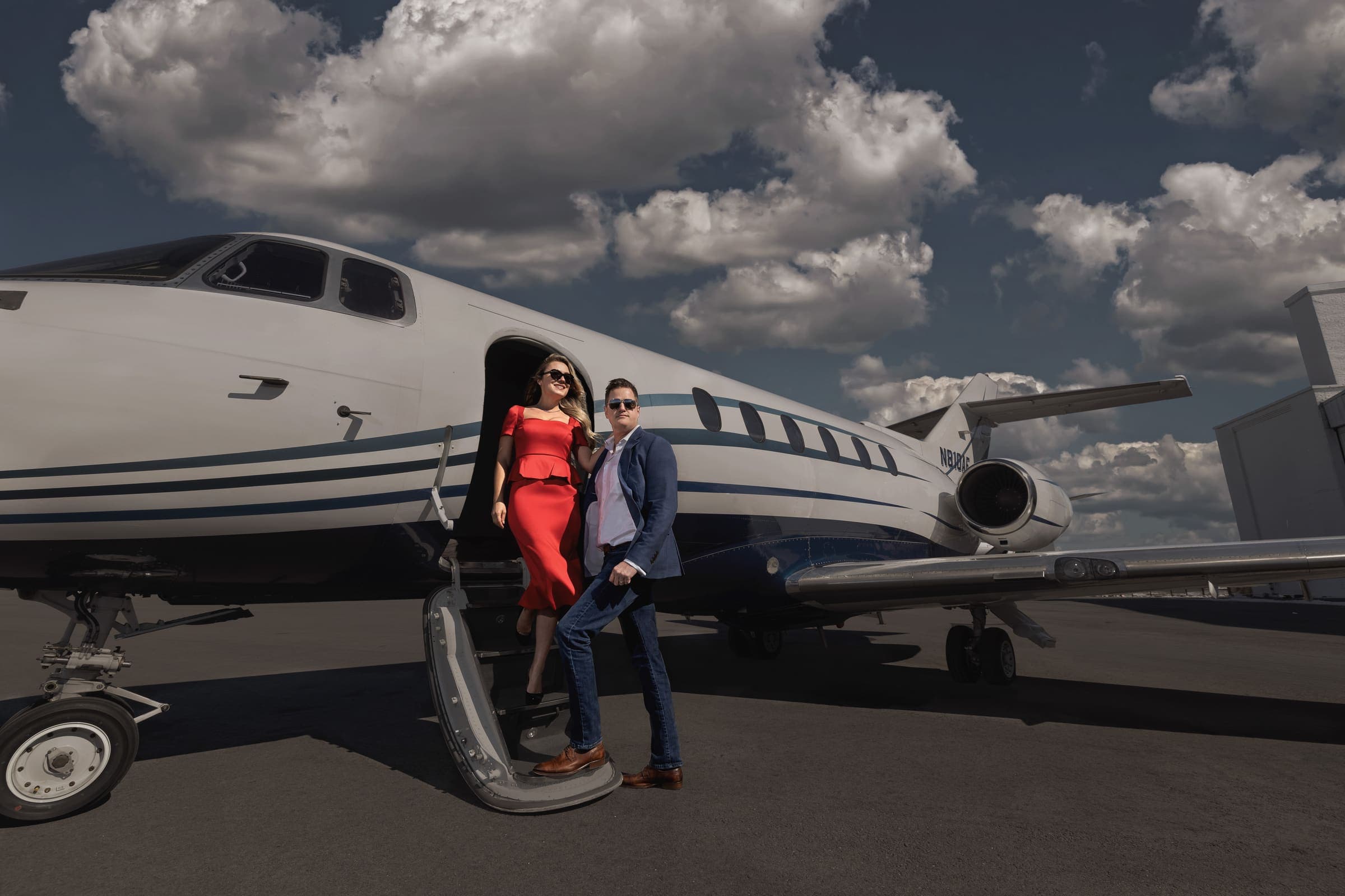 Secure Air Charter commercial campaign photographed beside a private jet at golden hour